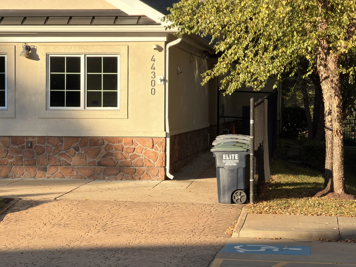 Trash containers beside the Ashbrook clubhouse
